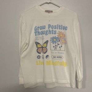 White long sleeve sweater with design